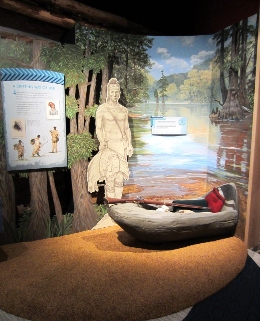 A display on trade shows how the arrival of white settlers in Alabama impacted the tribe. 