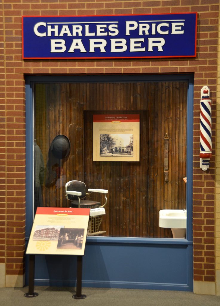 A barbershop tells the story of Charles Price, a Black barber in town.