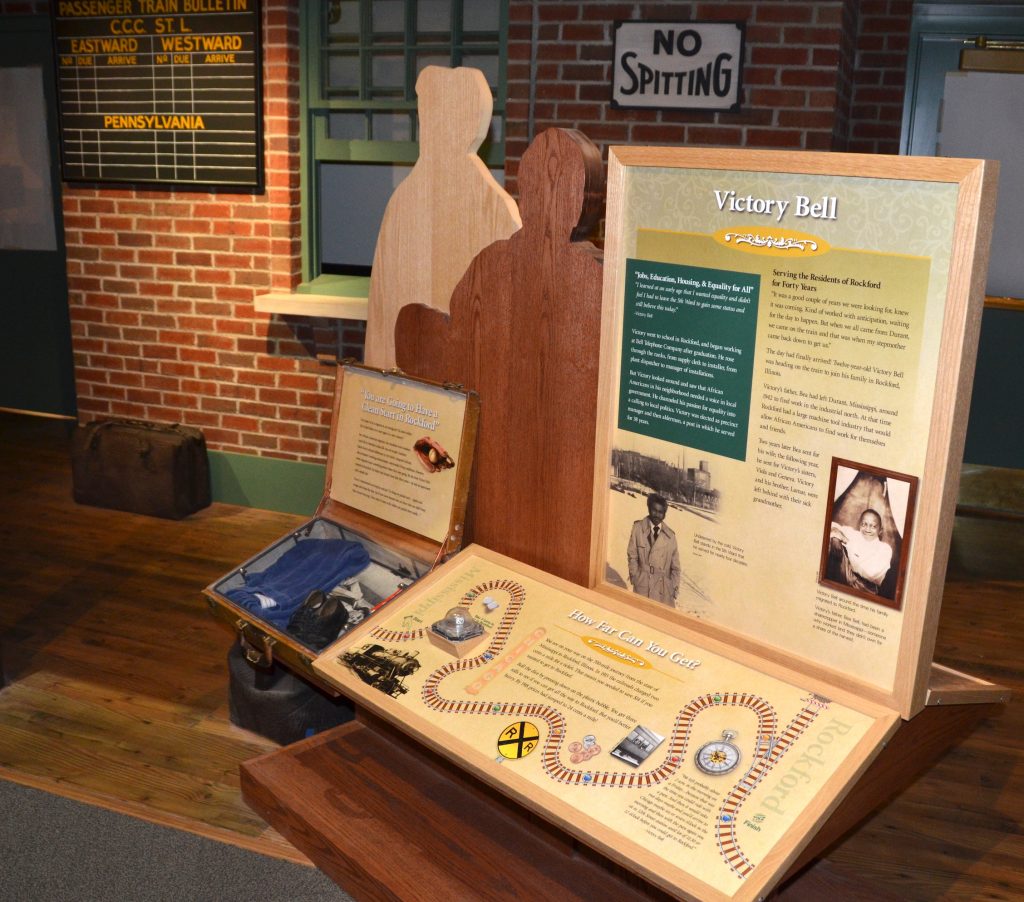 A freestanding display anchors the story of Victory Bell, the first Black man to serve on the Rockford City Council. Visitors can trace his journey from Mississippi to Illinois. 