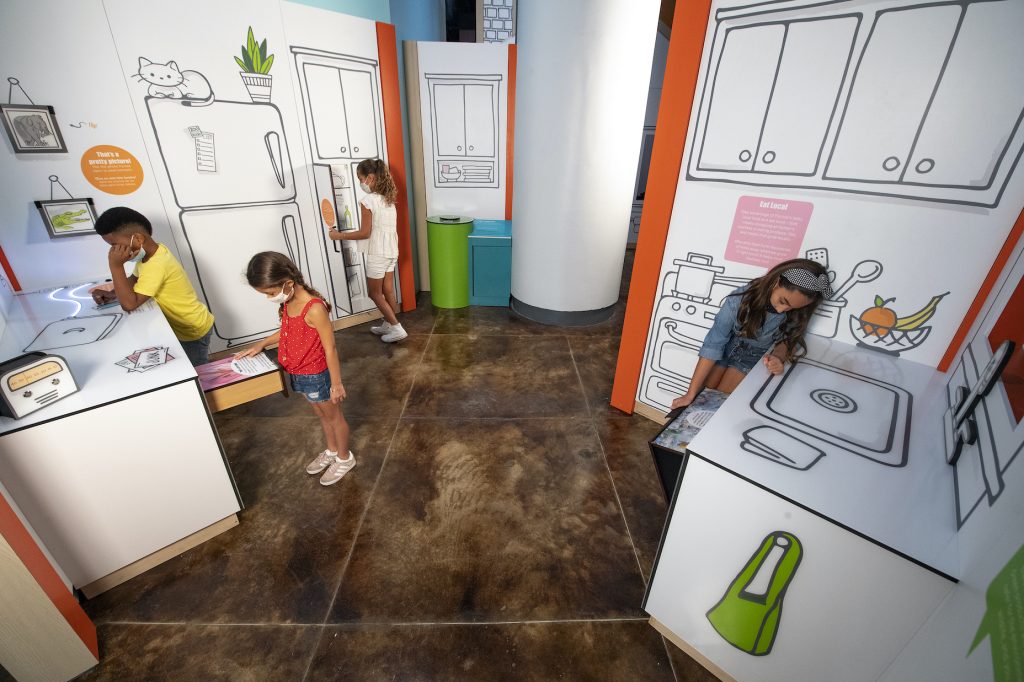 An illustrated house comes to life! Visitors can open doors and drawers, slide back photos, and manipulate the display in other ways to see how they can impact conservation at home.

Photo by Ron Magill/Zoo Miami